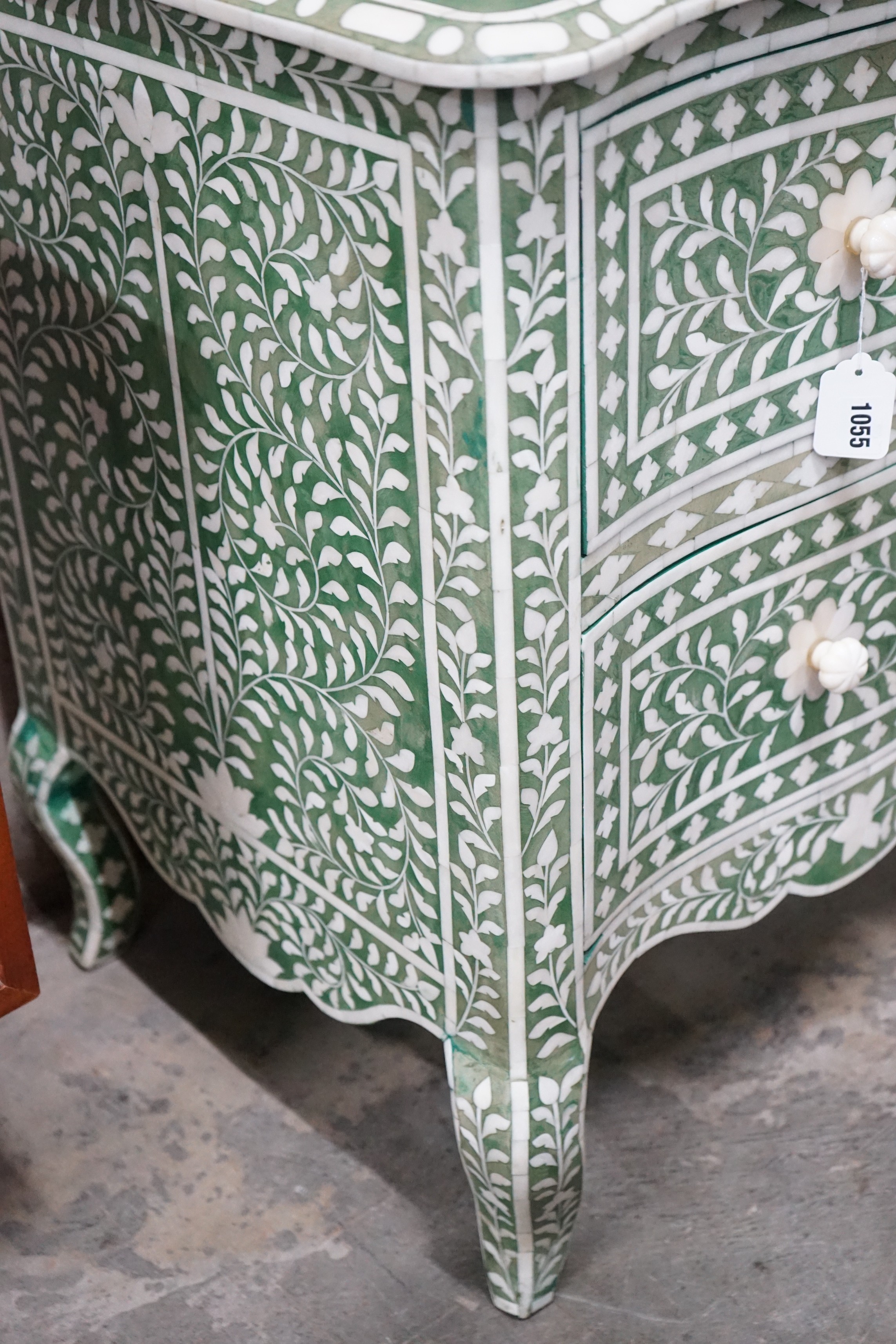 A contemporary green stained bone two drawer commode width 106cms, depth 50cms, height 76cms.